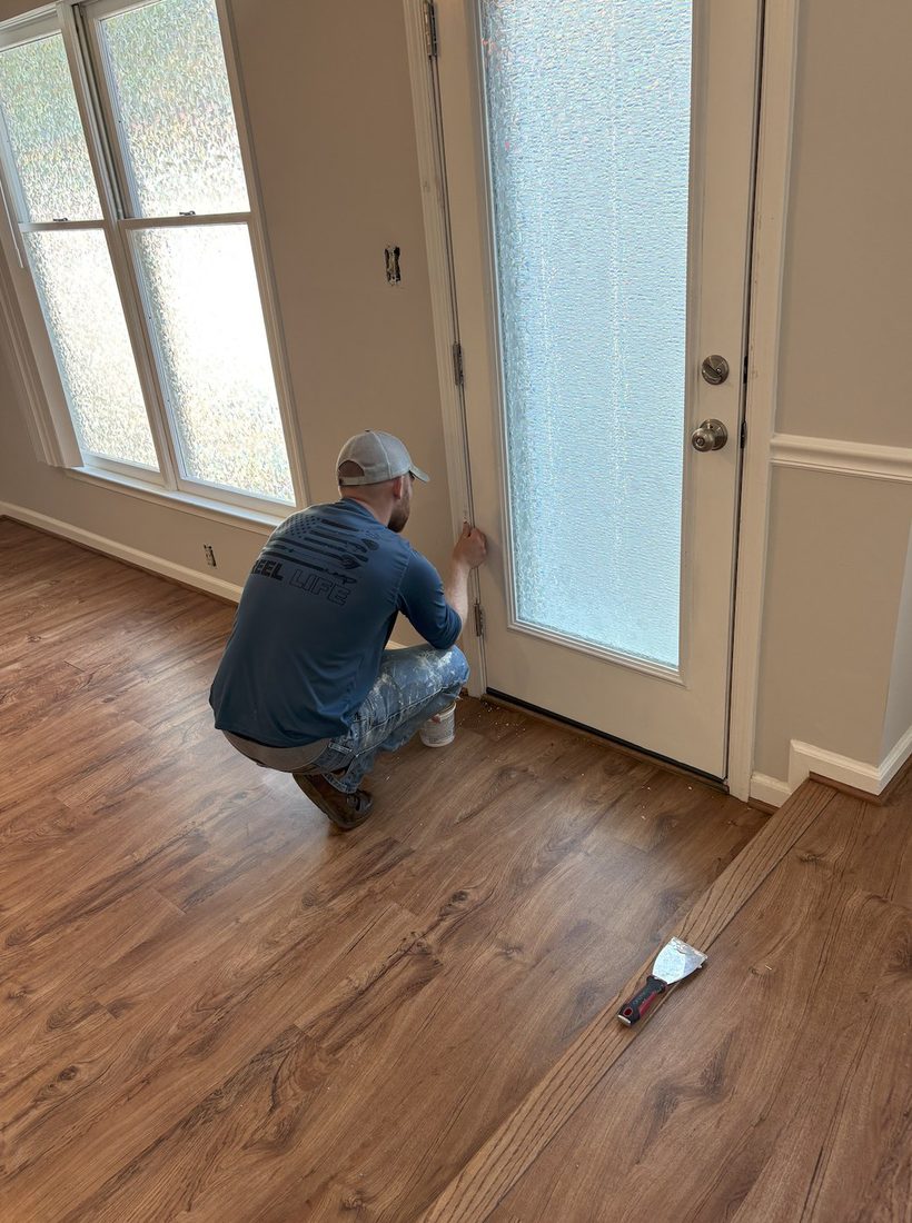 Lucas Autrey of Carolina Home Services working inside a customer's home