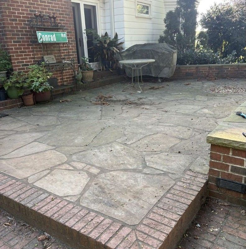 Flagstone patio before pressure washing